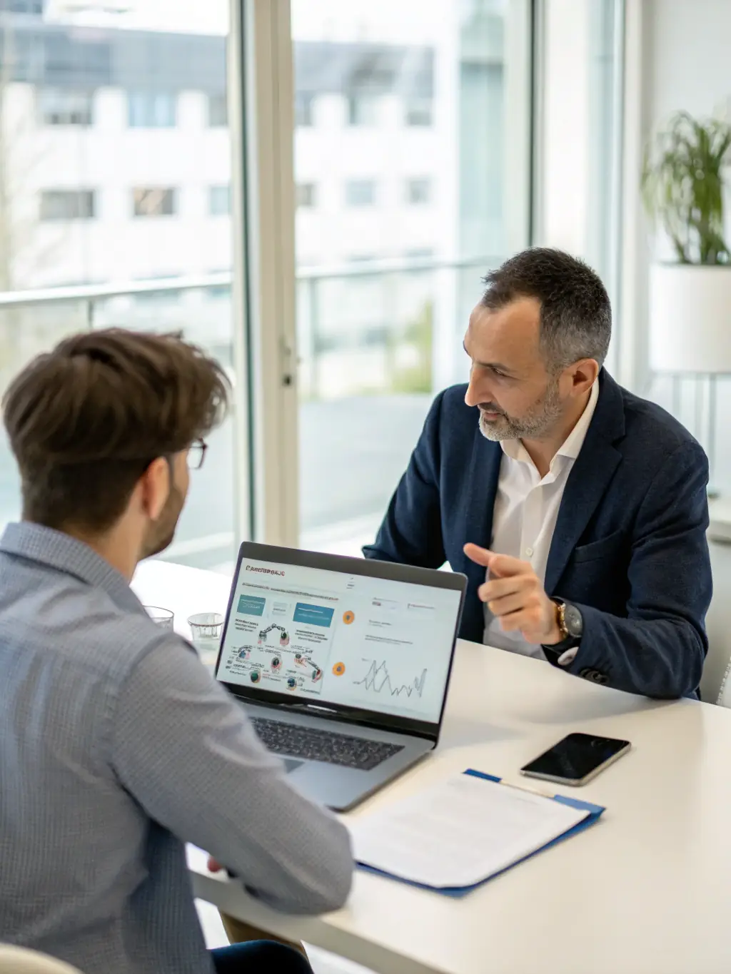 A consultant discussing strategies with a client in a professional setting, emphasizing collaboration and a clear roadmap, used to represent Nextgen360agency's strategic consulting service.